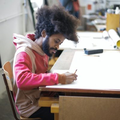 Man writing at desk