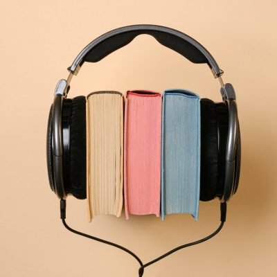 headphones and books neutrals